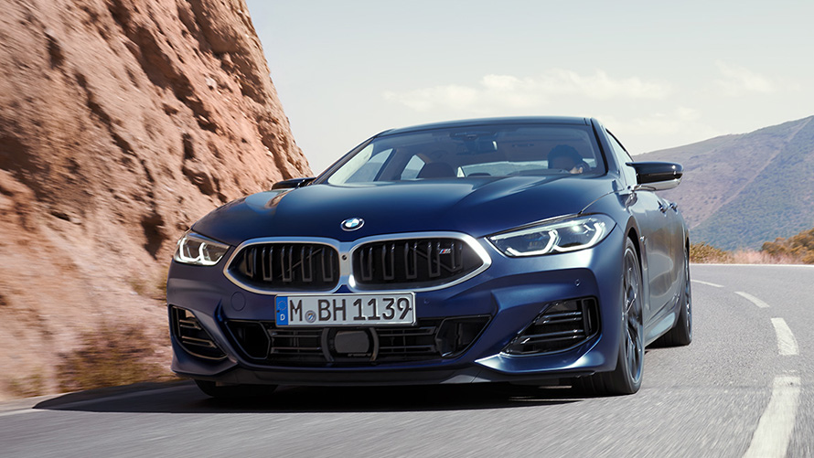 BMW serije 8 Gran Coupé (G16) tročetvrtinski pogled straga u vožnji BMW serije 8 Gran Coupé (G16) tročetvrtinski pogled straga u vožnji