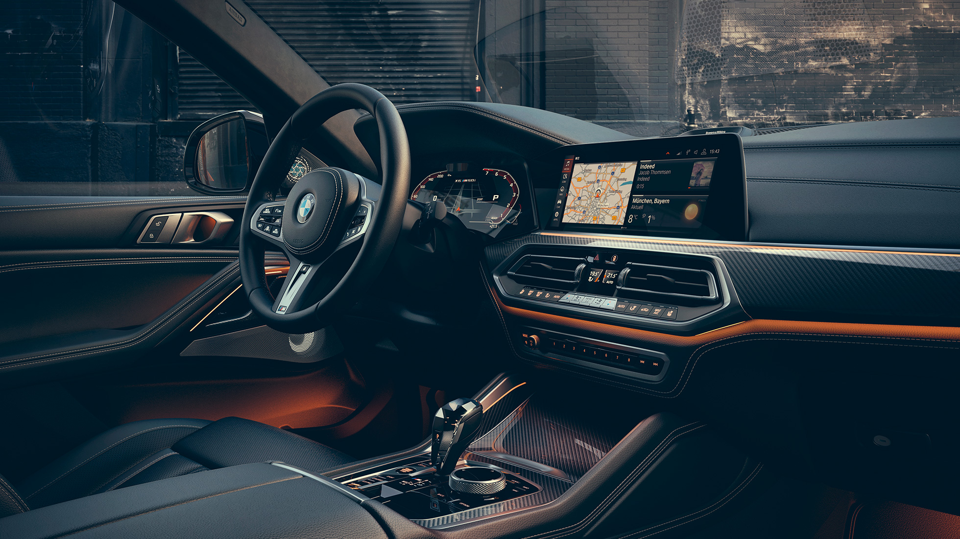 Unutrašnjost BMW-a X6 M50i Detaljan prikaz unutrašnjosti BMW-a X6 M50i s prikazom središnje konzole.
